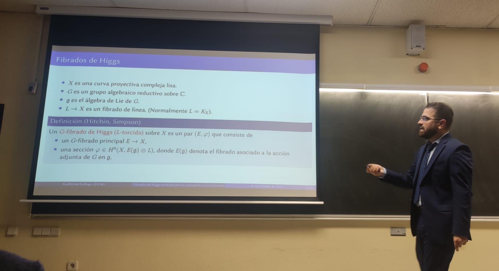 me talking with slides, and wearing a suit